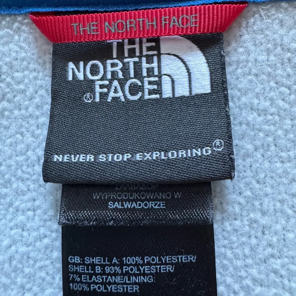 The North Face Men’s gray quarter zip with blue details.  Size medium